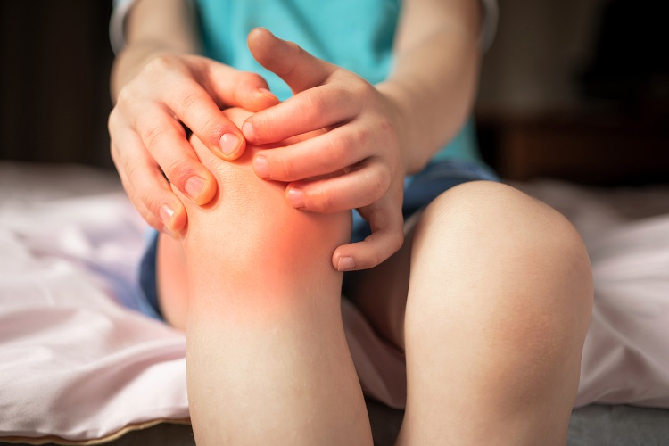 pain in the knee joints of the child